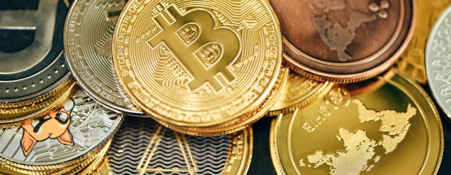 Cryptocurrency coins representing digital currency payment acceptance for Texas businesses